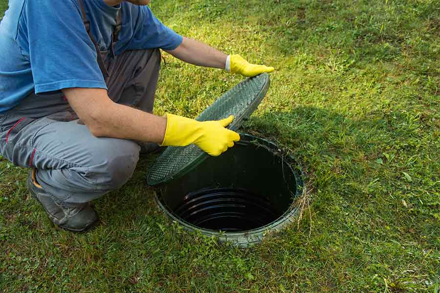 Plumber Opening Septic Cover | Septic Tanks in Armidale