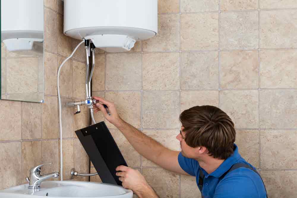 Hot Water System Technician Doing Water Heater Maintenance Check